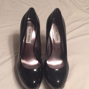 Platform black and metallic embellished high heels